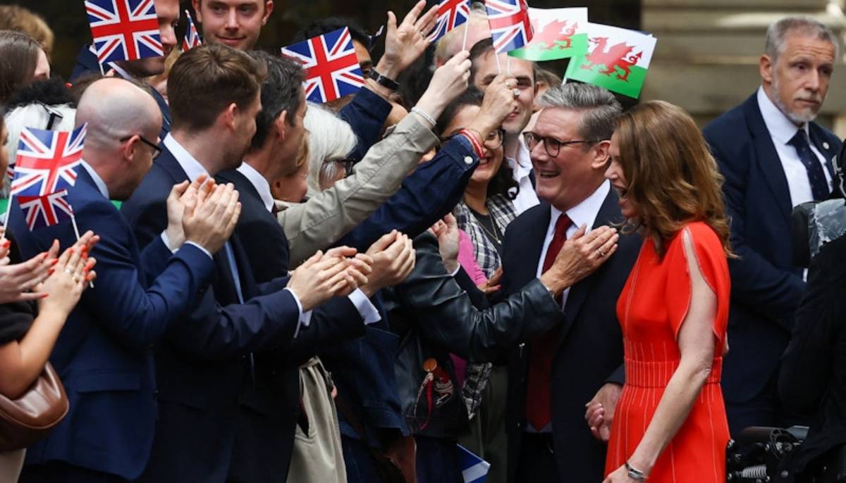 Labour party leader and current UK PM Keir Starmer and his wife Victoria greet supporters in Downing Street, July 5, 2024. — Reuters