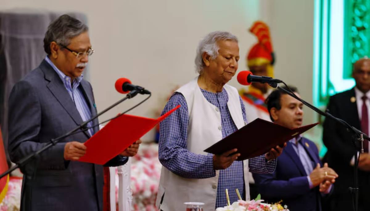 Bangladeshi President Mohammed Shahabuddin (left) administers oath-taking ceremony of Nobel laureate Muhammad Yunus as the country’s head of the interim government in Bangladesh at the Bangabhaban, in Dhaka, Bangladesh on August 8, 2024— Reuters