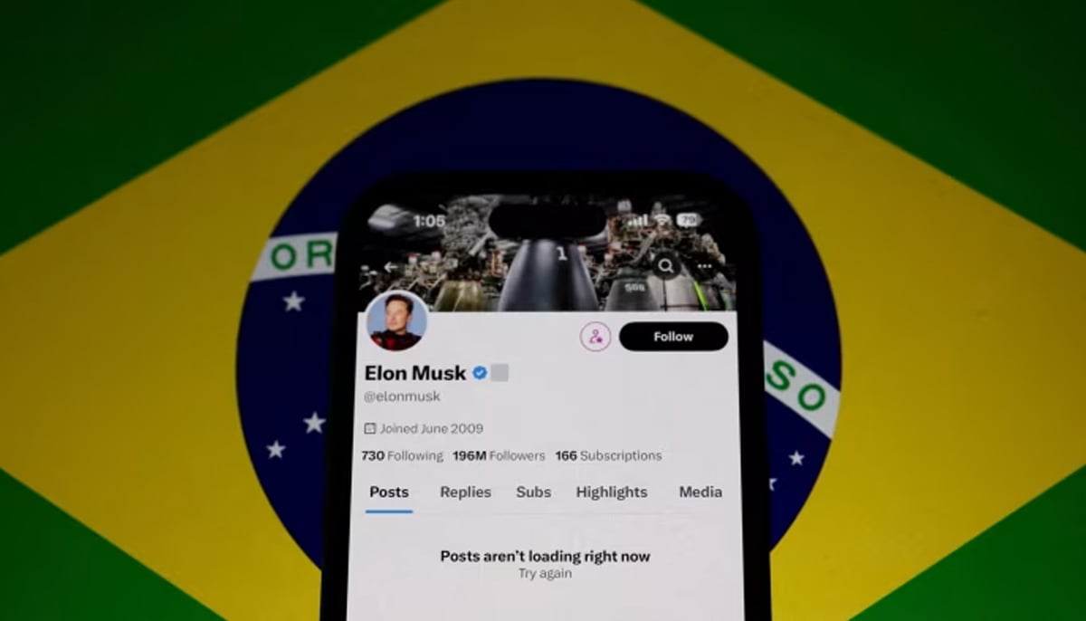 A representational image of a cellphone showing X owner Elon Musks account against the backdrop of of Brazils flag. — Reuters/File