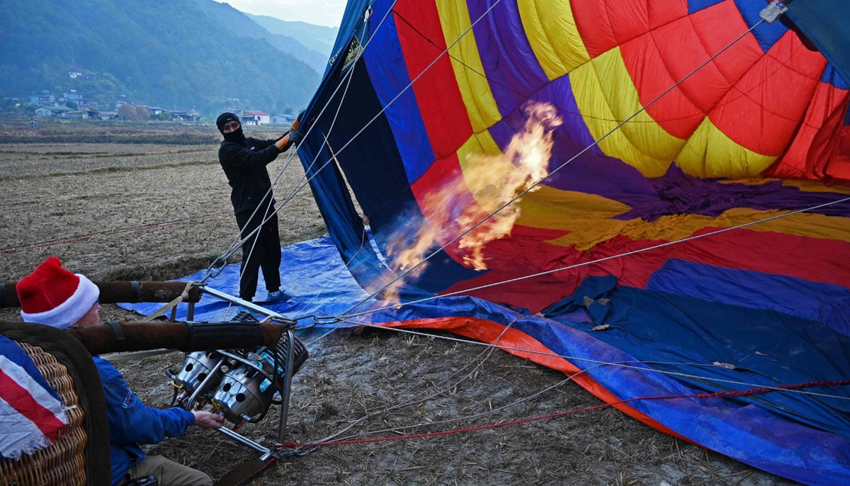 People are getting ready for the international festival at Pokhara in Nepal on December 25, 2024. — AFP