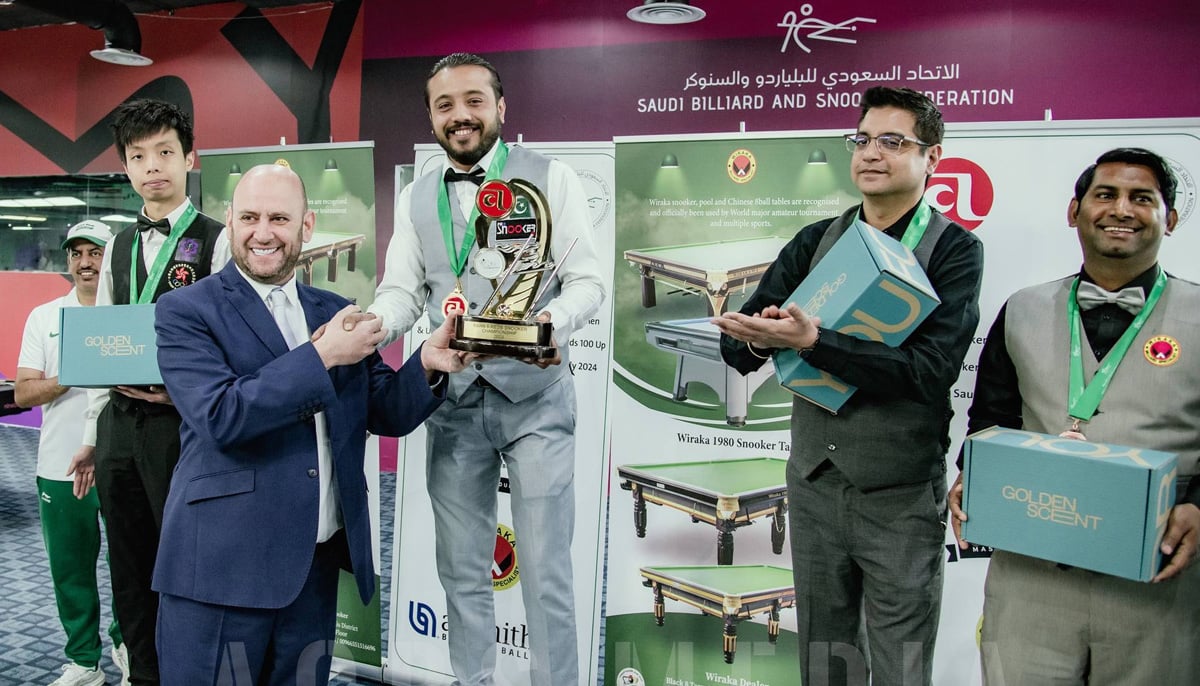 Pakistans Awais Munir receives trophy after winning the Asian 6-Red Snooker Championship title in Riyadh, Saudi Arabia. — Facebook/@acbsport/File