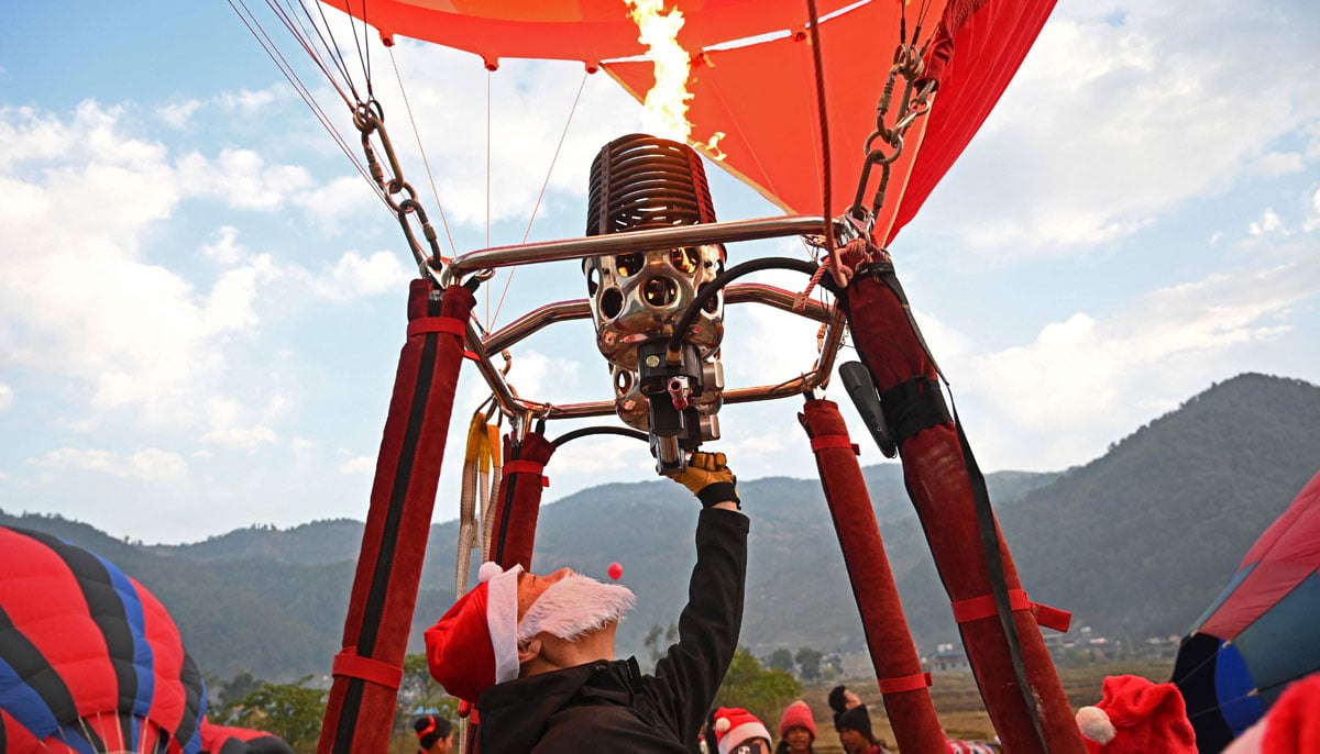 A man is in action during the international festival at Pokhara in Nepal on December 25, 2024. — AFP