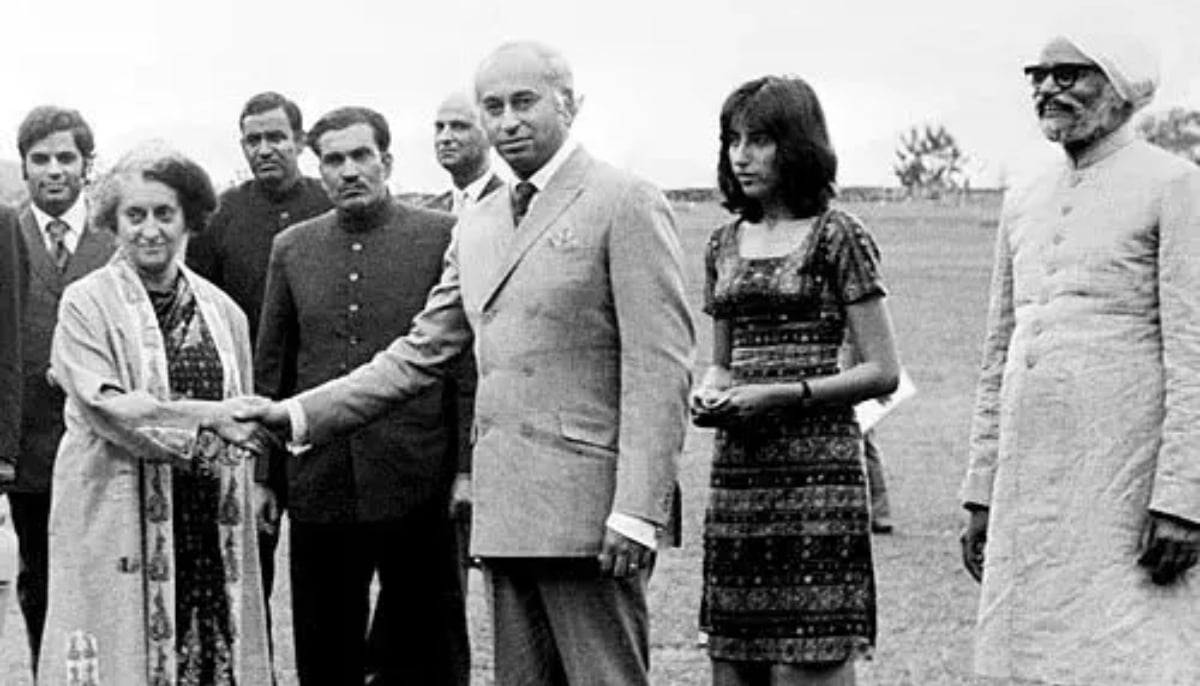 Benazir Bhutto is shown in 1972 standing next to her father and then-president Zulfikar Ali Bhutto as he shakes hands with former Indian prime minister Indira Gandhi in Simla, India. — AFP/File