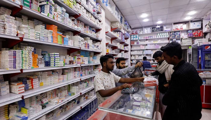 Customers buy medicine from a medical supply store in Karachi on February 9, 2023. — Reuters