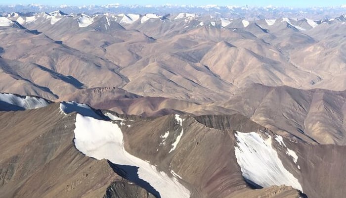 Snow-covered mountain range is seen from a passenger airplane in Ladakh region September 14, 2020. — Reuters