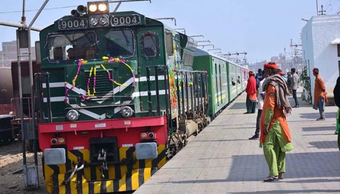 A view of Green Line Express train attached with new imported coaches from China at a railway station. — APP/File