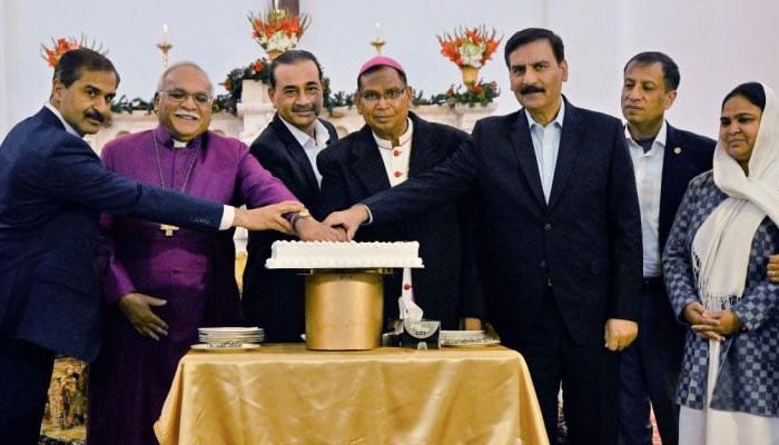 Chief of Army Staff (COAS) General Syed Asim Munir (third from left) cuts cake to celebrate Christmas at St. Joseph’s Catholic Cathedral Church on December 25, 2024. — ISPR