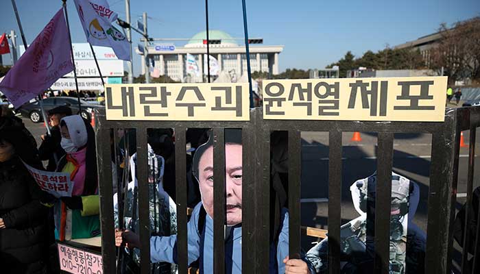 Protesters participate in a rally calling for the impeachment of South Korean President Yoon Suk Yeol in front of the National Assembly in Seoul, South Korea on December 14, 2024. — Reuters