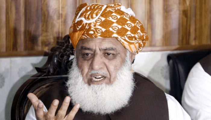 Jamiat Ulema-e-Islam-Fazl (JUI-F) Chief Maulana Fazlur Rehman gestures during a gathering. — APP/File