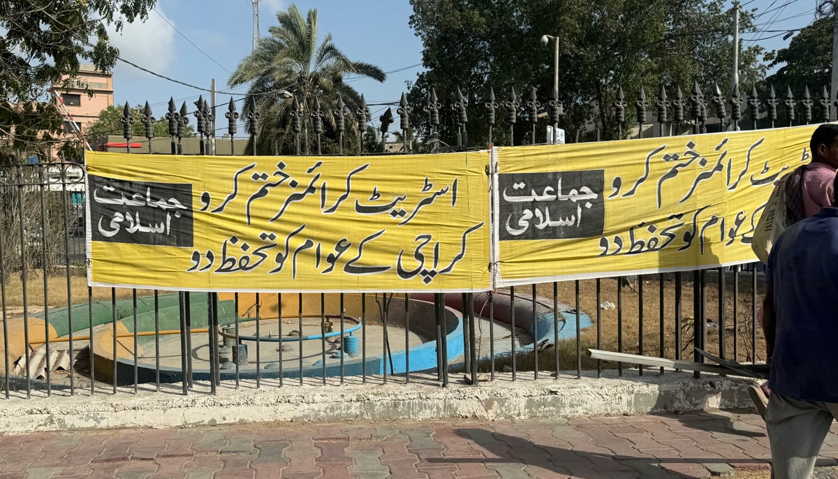 A banner against the rise in street crimes is placed in Saddar by the Jamaat-e-Islami in Karachi. — Photo by author