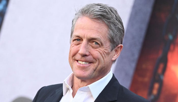 Hugh Grant jokes he bans his wife from watching hia ONE ’90s flop movie