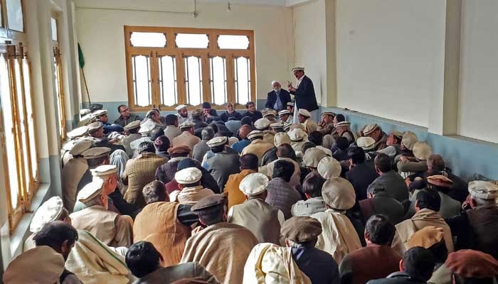 This photograph taken on December 3, 2024, shows men gathered during a meeting at a mosque, after clashes in Parachinar. — AFP