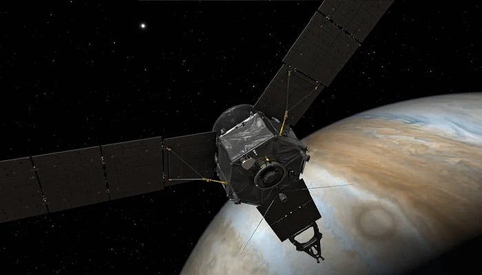 An artists depiction of Nasas Juno spacecraft at Jupiter, with solar arrays and main antenna facing the sun and Earth. — Nasa/File