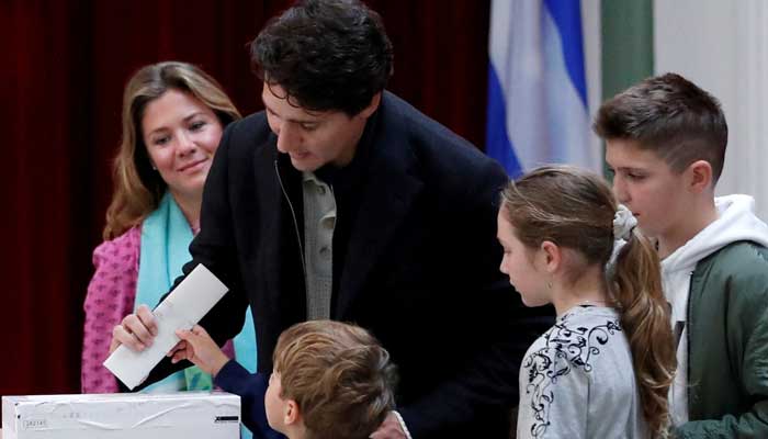 Liberal leader and Canadian Prime Minister Justin Trudeau, accompanied by his wife Sophie Gregoire Trudeau, their sons Xavier and Hadrien, and their daughter Ella-Grace, votes in the federal election in Montreal, Quebec, Canada October 21, 2019. — Reuters